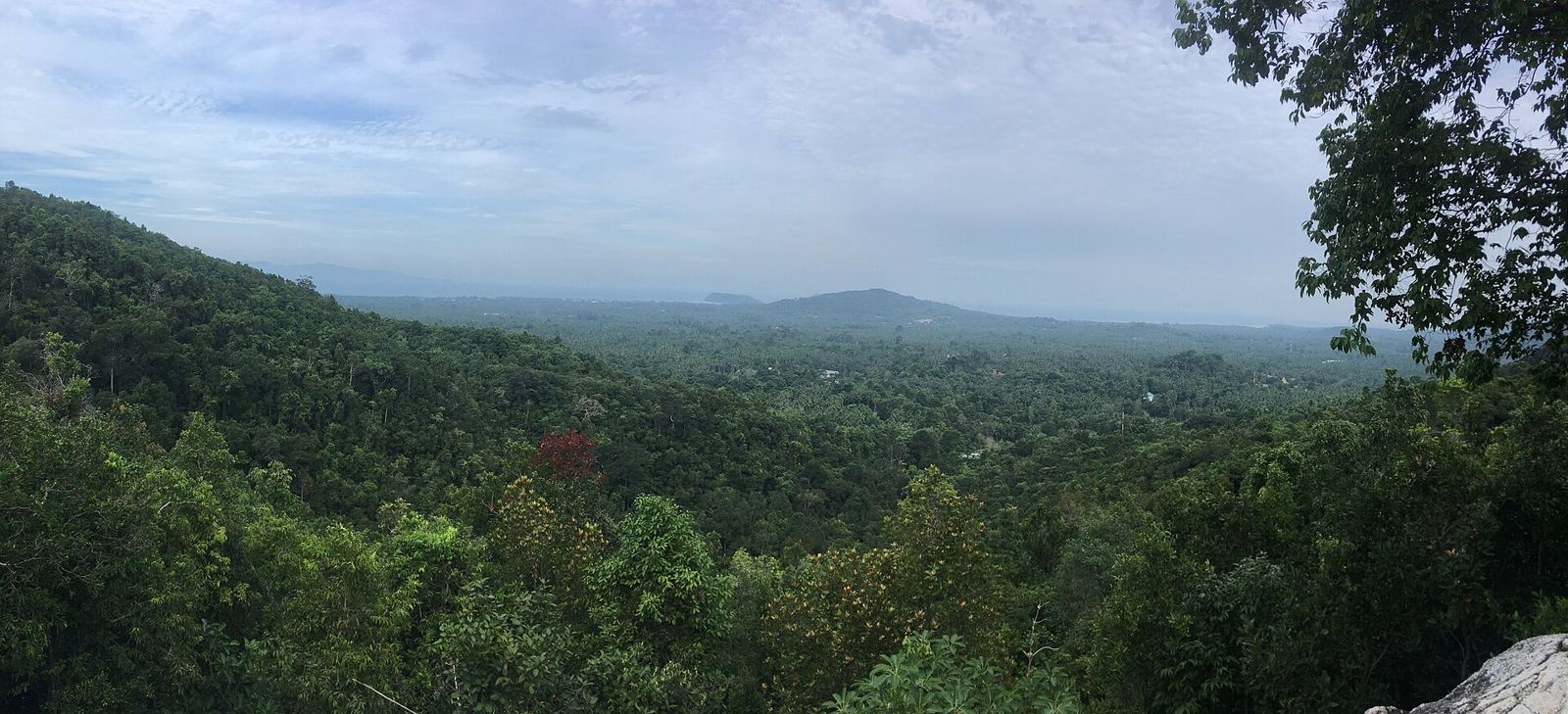 Panoramic view over the jungle and south-west coast of Koh Phangan towards Koh Tae Nai, from the viewpoint above Phaeng Waterfall