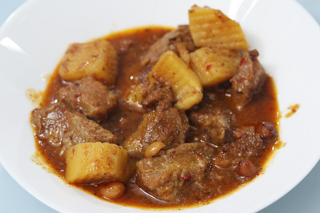 Bowl of massaman curry with potatoes and meat, a classic southern Thai curry